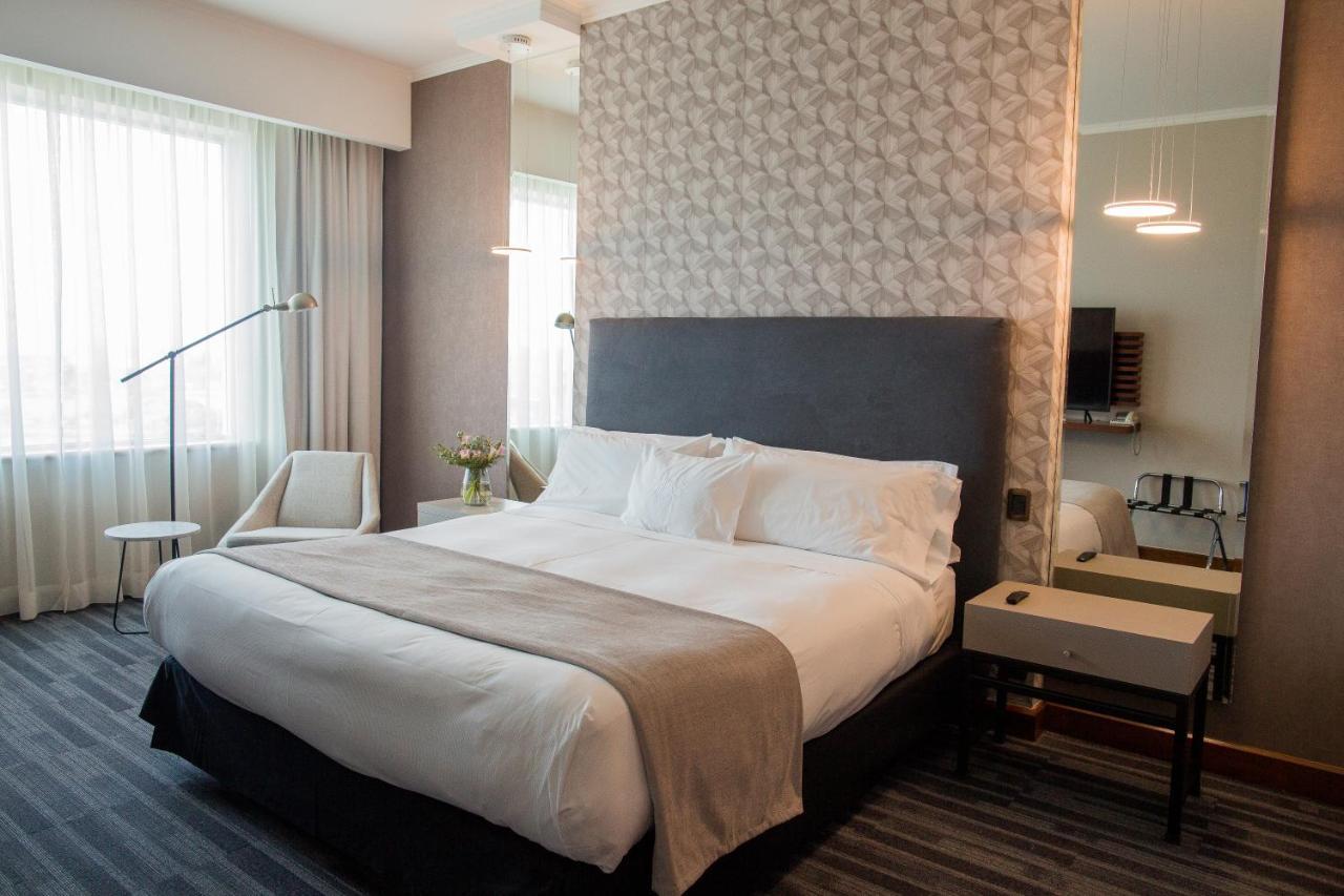 Mds Hotel Concepcion Ngoại thất bức ảnh A bedroom in a hotel